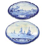 TWO SIMILAR DUTCH DELFT BLUE AND WHITE SHAPED OVAL WALL PLAQUES