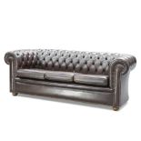 A CHESTERFIELD DEEP-BUTTONED BROWN LEATHER SOFA