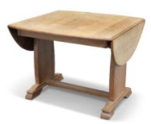AN ARTS AND CRAFTS OAK DROPLEAF SUPPER TABLE