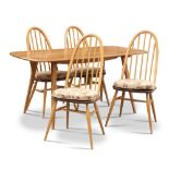 AN ERCOL LIGHT ELM DINING TABLE AND FOUR CHAIRS