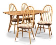 AN ERCOL LIGHT ELM DINING TABLE AND FOUR CHAIRS