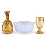 AN ART DECO MOULDED FROSTED BLUE GLASS BOWL, PROBABLY JOBLING, AND TWO PIECES OF GERMAN AMBER GLASS