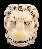 A LARGE CARVED IVORY HEAD OF A LION