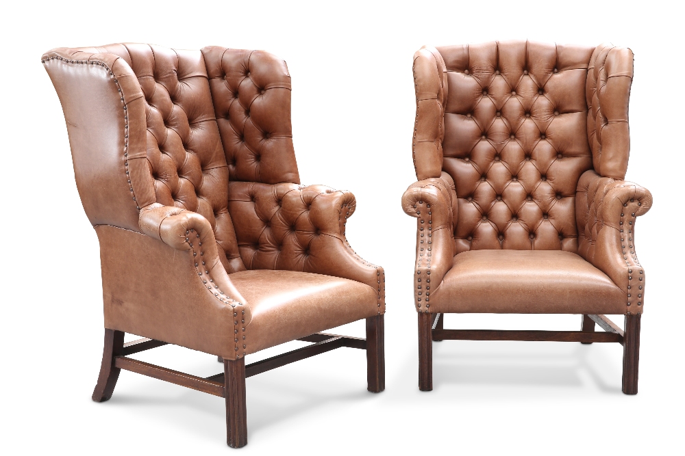 A GOOD PAIR OF DEEP-BUTTONED BROWN LEATHER WING-BACK LIBRARY CHAIRS