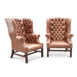 A GOOD PAIR OF DEEP-BUTTONED BROWN LEATHER WING-BACK LIBRARY CHAIRS