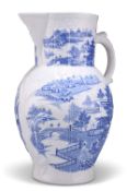 A LARGE 18TH CENTURY ENGLISH BLUE AND WHITE CABBAGE LEAF JUG