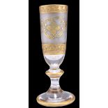 A CONTINENTAL HEAVY GILT CHAMPAGNE GLASS