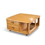 AN ERCOL 'PANDORA'S BOX' LIGHT ELM COFFEE TABLE