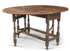 AN 18TH CENTURY OAK GATELEG DINING TABLE