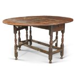 AN 18TH CENTURY OAK GATELEG DINING TABLE