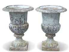 A PAIR OF CAST IRON GARDEN URNS