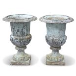 A PAIR OF CAST IRON GARDEN URNS