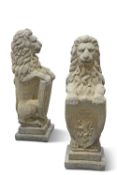 A PAIR OF RECONSTITUTED STONE HERALDIC LIONS