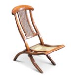 A MAHOGANY AND CANEWORK FOLDING CAMPAIGN CHAIR