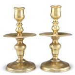 A PAIR OF HEEMSKIRK BRASS CANDLESTICKS