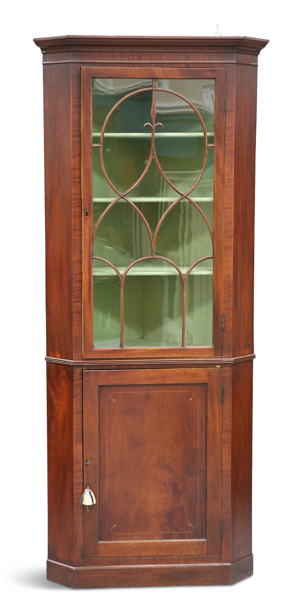 A GEORGE III MAHOGANY FLOOR-STANDING CORNER CABINET