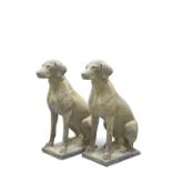 A PAIR OF RECONSTITUTED STONE HUNTING DOGS