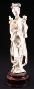 A CHINESE IVORY FIGURE OF A MAIDEN, LATE 19TH CENTURY