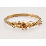 A VICTORIAN 9 CARAT GOLD CITRINE BANGLE