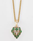 AN EMERALD AND DIAMOND CLUSTER PENDANT ON CHAIN