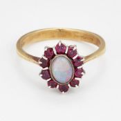 AN 18 CARAT GOLD OPAL AND RUBY CLUSTER RING