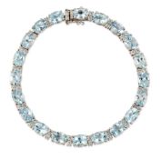 AN AQUAMARINE AND DIAMOND LINE BRACELET