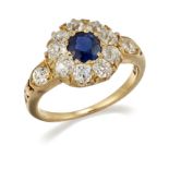 A SAPPHIRE AND DIAMOND CLUSTER RING