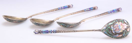 A SET OF FOUR RUSSIAN SILVER-GILT AND ENAMEL SPOONS