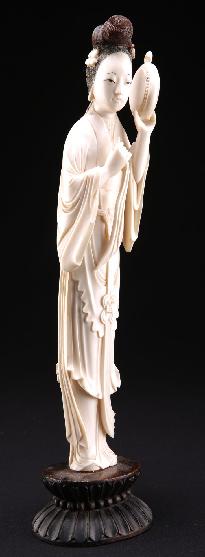 A CHINESE IVORY FIGURE OF A MAIDEN, LATE 19TH CENTURY