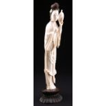 A CHINESE IVORY FIGURE OF A MAIDEN, LATE 19TH CENTURY