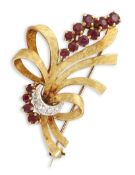 AN 18 CARAT GOLD RUBY AND DIAMOND BROOCH