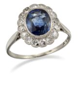 A SAPPHIRE AND DIAMOND CLUSTER RING