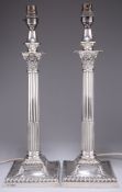 A PAIR OF EDWARDIAN SILVER CORINTHIAN COLUMN LAMP BASES