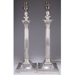 A PAIR OF EDWARDIAN SILVER CORINTHIAN COLUMN LAMP BASES