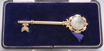 A GEORGE VI SILVER-GILT PRESENTATION KEY