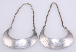 A PAIR OF GEORGE III SILVER WINE LABELS