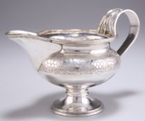 A GEORGE V SILVER CREAM JUG