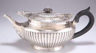 AN EDWARDIAN SILVER TEAPOT