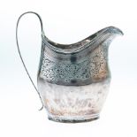 A GEORGE III SILVER CREAM JUG