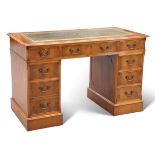 A GEORGIAN STYLE YEW WOOD PEDESTAL DESK