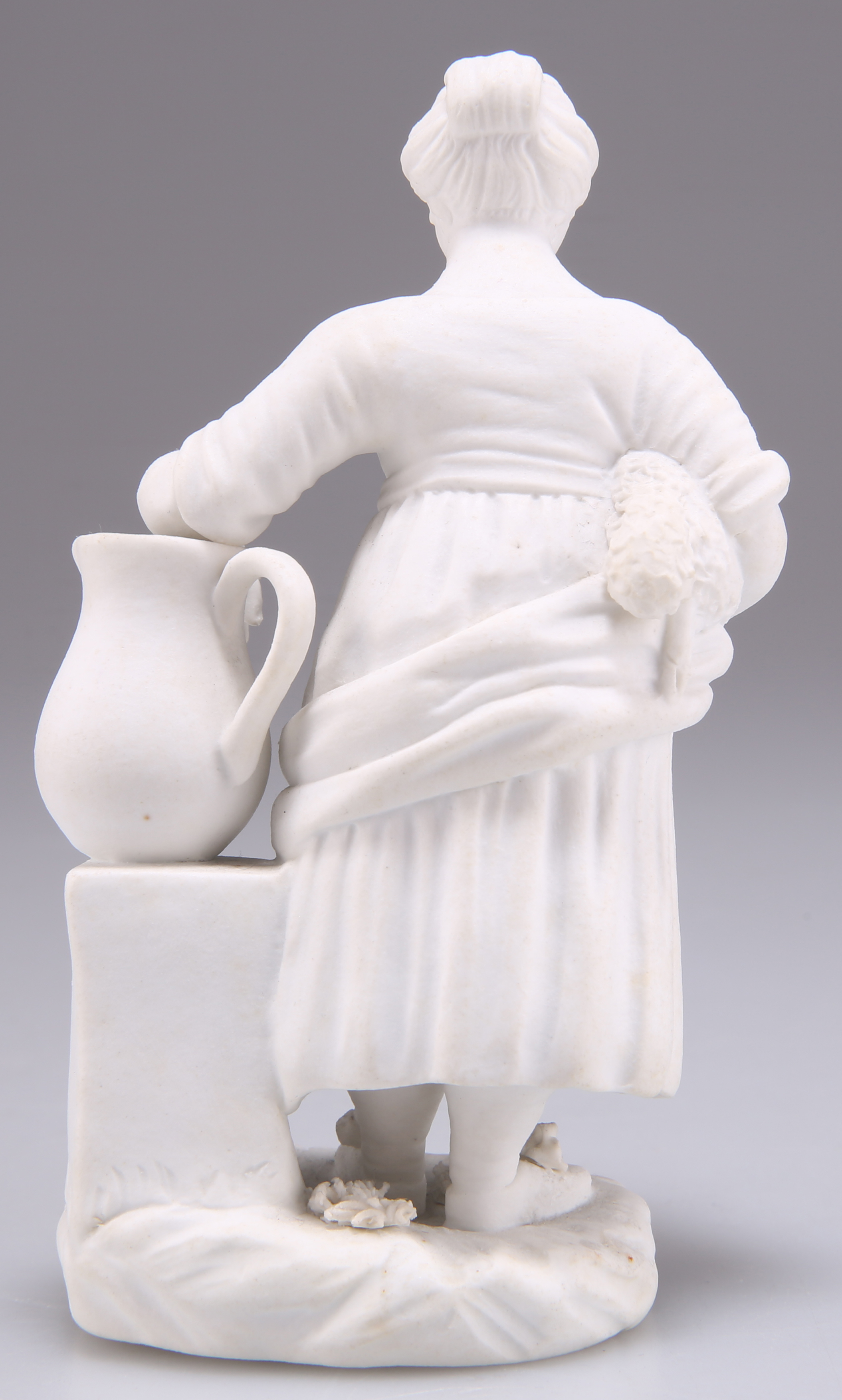 A BISCUIT PORCELAIN FIGURE OF CHILD, PROBABLY ROCKINGHAM - Image 2 of 2