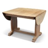 AN ARTS AND CRAFTS OAK DROPLEAF SUPPER TABLE