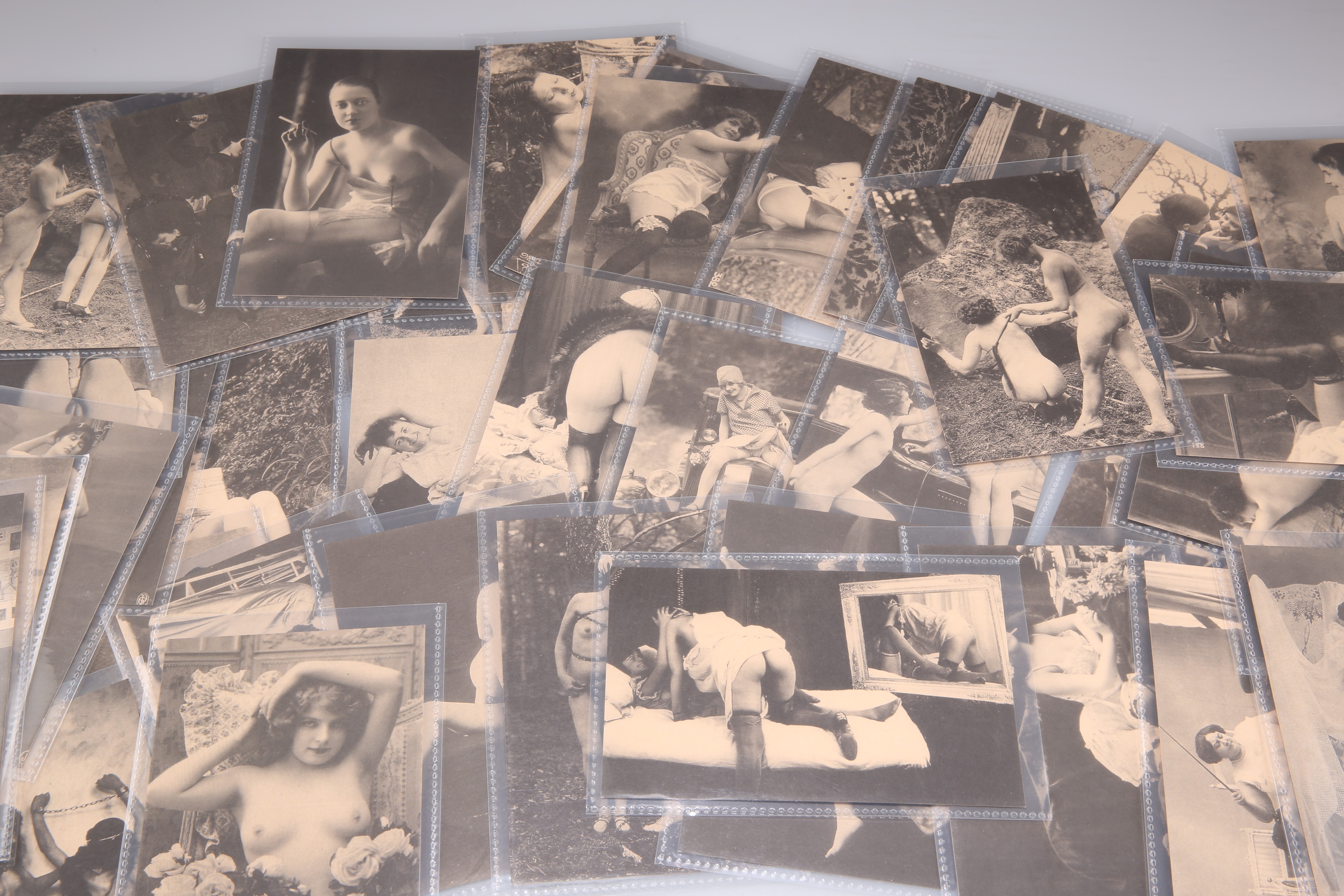 A COLLECTION OF FIFTY-EIGHT MONOCHROME EROTIC POSTCARDS. (58)