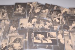 A COLLECTION OF FIFTY-EIGHT MONOCHROME EROTIC POSTCARDS. (58)