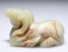 A JADE CARVING OF A RECUMBENT RAM