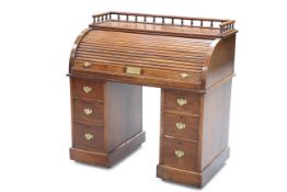 A LATE VICTORIAN MAHOGANY ROLL-TOP DESK