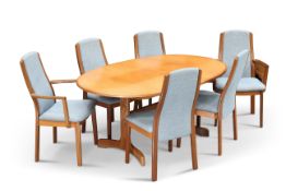 A G-PLAN TEAK EXTENDING DINING TABLE AND SIX CHAIRS
