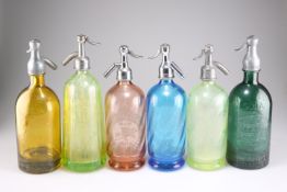 A GROUP OF SIX 20TH CENTURY COLOURED GLASS SODA SIPHONS