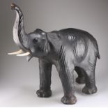 A LARGE VINTAGE LEATHER MODEL OF AN ELEPHANT