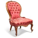 A VICTORIAN WALNUT AND UPHOLSTERED NURSING CHAIR